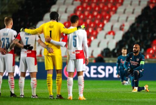 Arsenal's two-goal scorer Lacazette stared directly at the Slavia Prague's players while taking the knee before kick-off. The Slavia players stood while the visiting side made the anti-racism gesture of "taking the knee"