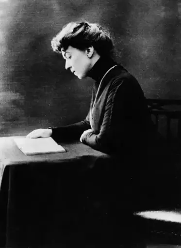 A picture of comrade Allexandra Kollontai reading a book. She was a Russian revolutionary, politician, diplomat and Marxist theoretician. She served as the People's Commissar for Welfare in Vladimir Lenin's government in 1917–1918. She was the first woman in history to be a cabinet minister, and one of the first women to be appointed as a diplomatic representative of a modern state, and the first to be promoted to the rank of ambassador.